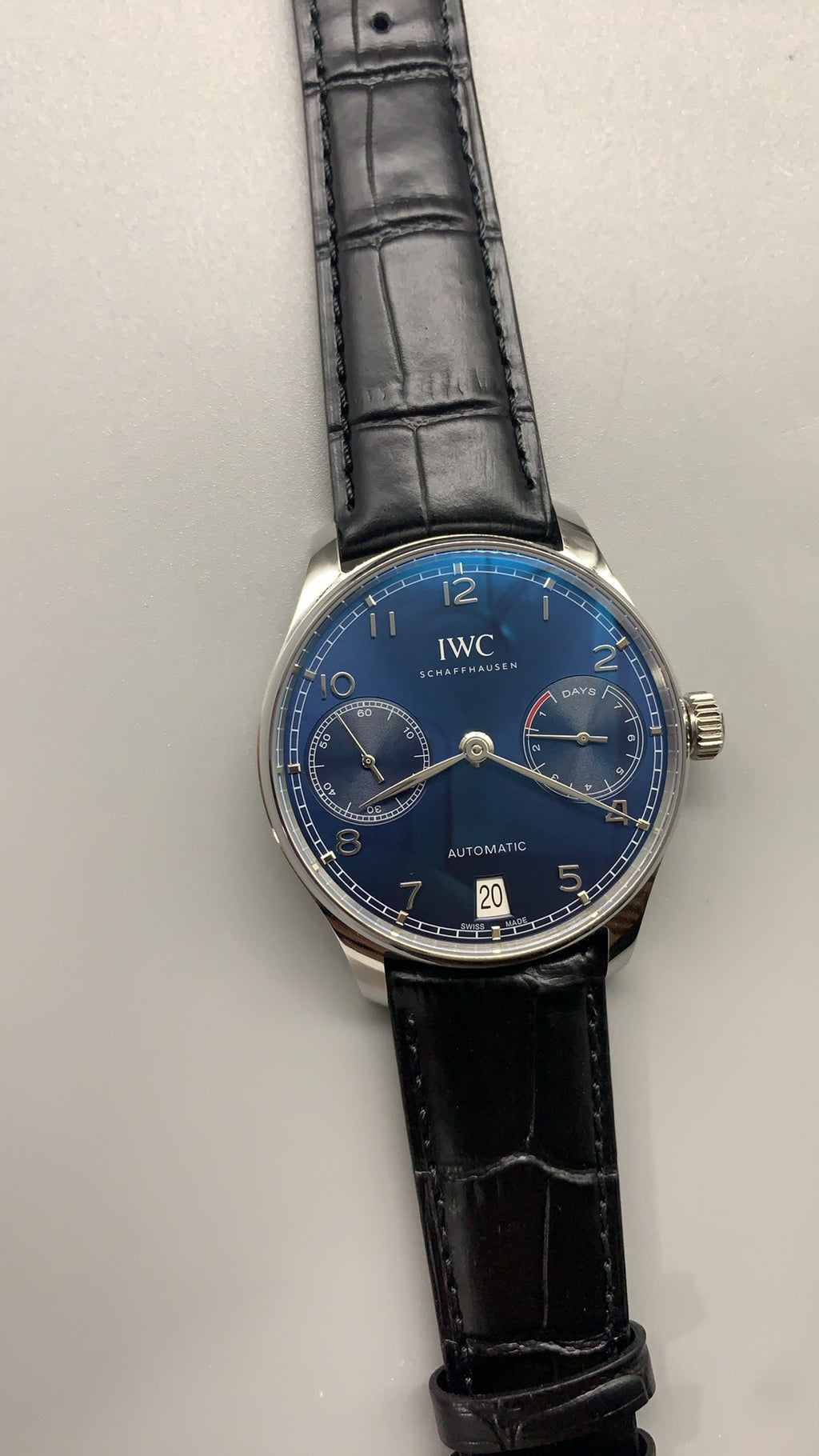 IWC Portugieser Automatic 7 Days | 42.3MM | ตัวเรือนสแตนเลสสตีล | พลังงานสำรอง 7 วัน | หน้าปัดสีน้ำเงิน | สายหนังจระเข้สีดำ | กลไกอัตโนมัติ Cal.52010